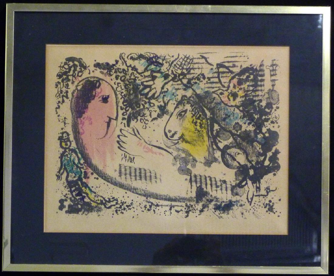 MARC CHAGALL LITHOGRAPH: Marc Chagall lithograph in colors on double page. Depicting woman in pink, man and horse. Measures 17 1/2" (44.4cm) x 13 1/2" (34.2cm) + 3" (7.6cm) mat & frame.