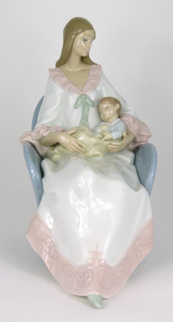 LLADRO 'MY LITTLE TREASURE' PORCELAIN FIGURINE: Lladro porcelain figure depicting a seated mother holding her sleeping son, #6503. Marked to underside. Measures 9" (23cm) height and length.