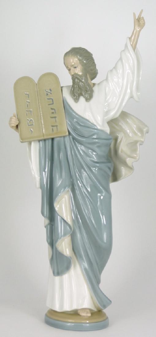 LLADRO 'MOSES' PORCELAIN FIGURINE: Lladro porcelain figure depicting Moses holding the Ten Commandments, #5170. Marked to underside. Measures 16 1/4" (41.2cm) height.
