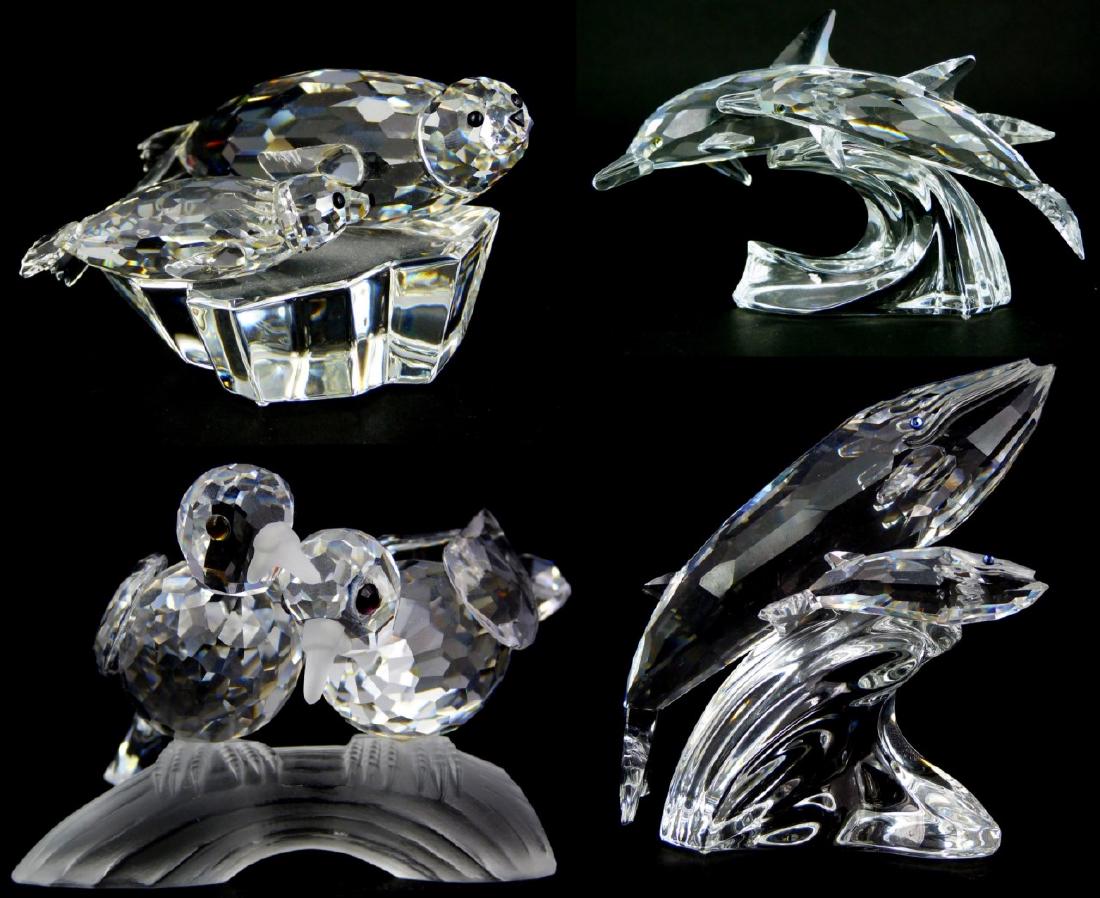 4pc SWAROVSKI CRYSTAL SOCIETY ANIMAL GROUPINGS: 4 Swarovski Crystal Society animal groups including Turtle Doves 1989, Lead Me Dolphins 1990, Save Me Seals 1991, Care For Me Whales 1992. Each marked and largest measures 4" (10.2cm) height.