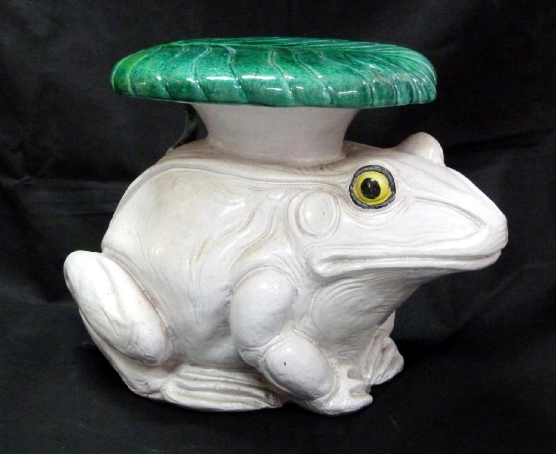 ITALIAN TOAD / FROG POTTERY GARDEN SEAT: Italian glazed terracotta garden stool in the form of a frog with lily pad to back. Measures 22" (56cm) length x 16 1/2" (41.8cm) height.