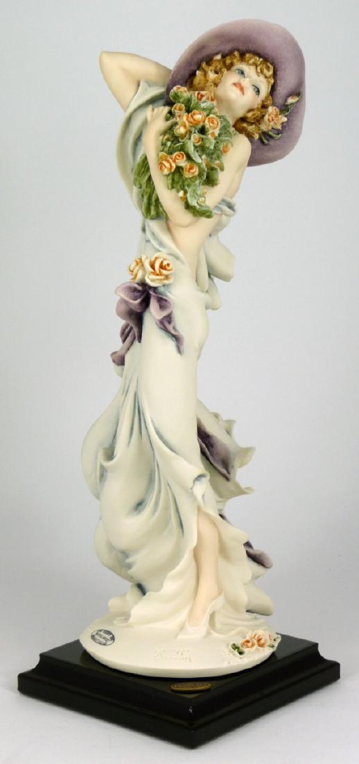 GIUSEPPE ARMANI 'PLAYFUL BREEZE' FIGURINE w BOX: Giuseppe Armani 'Playful Breeze' #1654C figure depicting a lady in gown with flowers. Member's Only 2003. Marked to base and holds original labels to underside. Includes certificate and original box. 