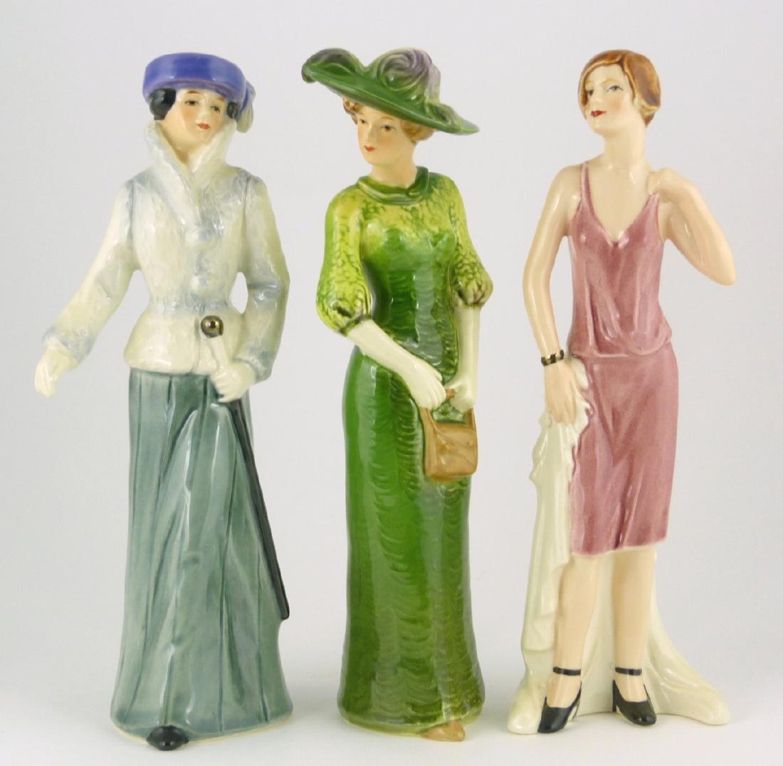 3pc GOEBEL PORCELAIN FIGURINES: 3 Goebel porcelain figures of ladies including Edwardian Grace 1911 #16283, Flapper Girl #16281 and Victorian Woman #16282. Each measures approx 8" (20.3cm) height.