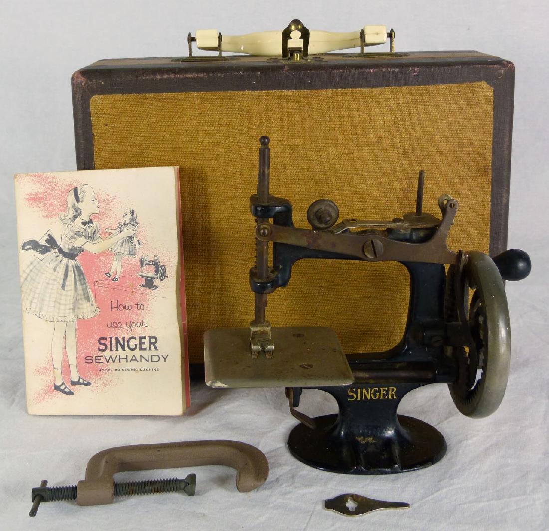 SINGER SEWHANDY w CASE: Singer Sewhandy model 20 with c-clamp. manual and case. Case measures 10 5/8" (27cm) x 7 7/8" (20cm).