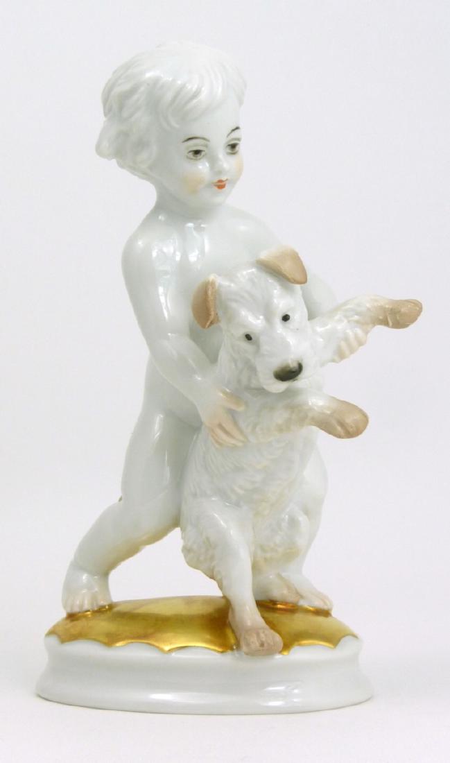 MAX FRITZ ROSENTHAL PORCELAIN BOY w TERRIER FIGURE: Max Hermann Fritz Rosenthal porcelain figurine depicting a boy with fox terrier dog. Marked and impressed MH Fritz to underside. Measures 6" (15.2cm) height.