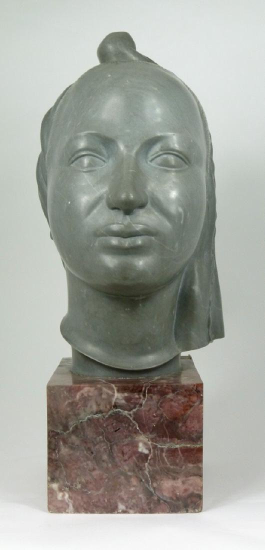 CARVED MARBLE EGYPTIAN BUST: Carved gray marble bust of an ancient Egyptian woman mounted on red marble base. Measures 15 1/2" (39.3cm) overall height.