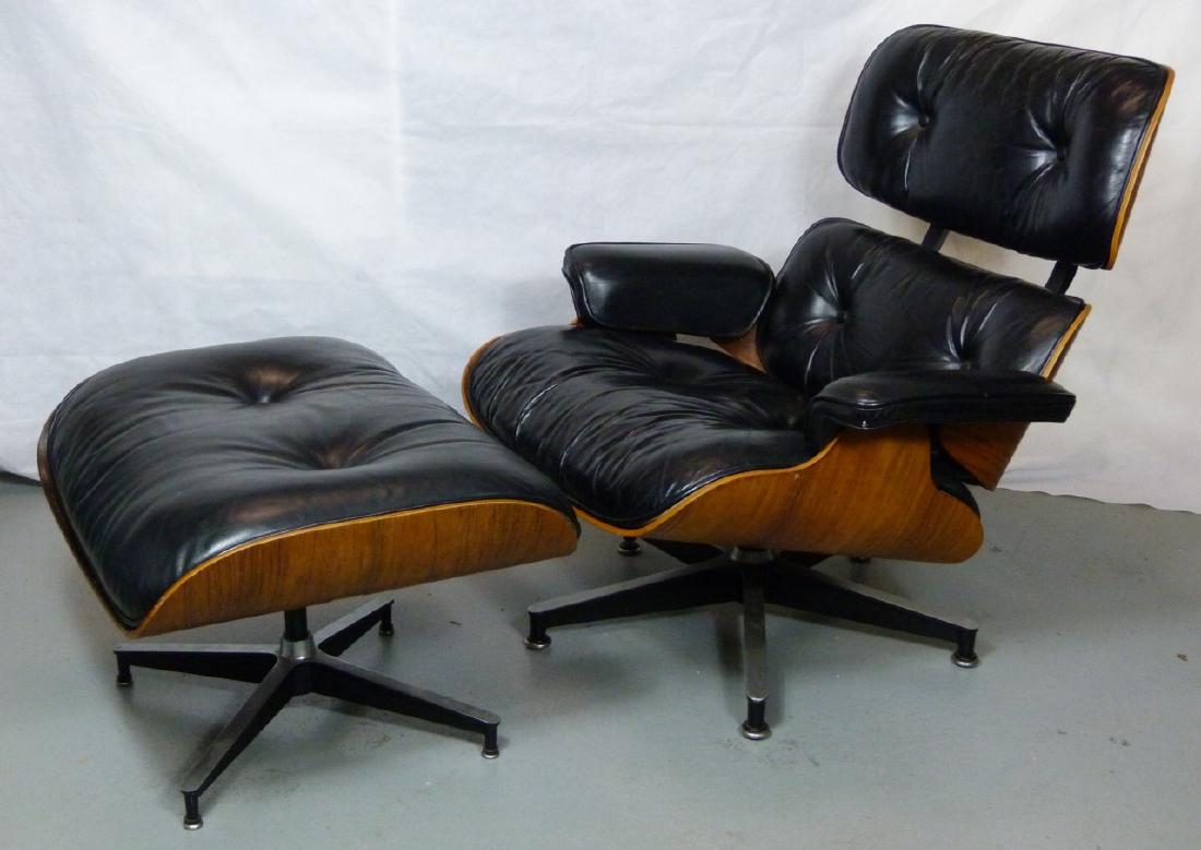 EAMES FOR HERMAN MILLER LOUNGE CHAIR & OTTOMAN: Charles and Ray Eames for Herman Miller model 670 and 671 vintage lounge chair and ottoman. Wood frame with tufted black leather upholstery covering the down insert and rising on an X form base. Holds