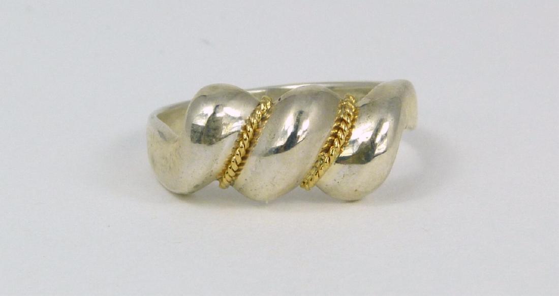 TIFFANY & CO STERLING SILVER 18kt YG RING: Tiffany & Company vintage sterling silver ring with ribbed design and twisted 18kt yellow gold accent. Marked T & Co, 925, 750. Ring size 5 1/2.