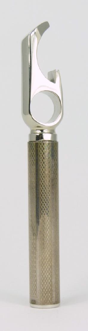 TIFFANY & CO STERLING CORKSCREW / BOTTLE OPENER: Tiffany & Co vintage sterling silver corkscrew and bottle opener. Corkscrew cover unscrews and gets inserted into hold to be used as handle. Marked Tiffany & Co, 925. Measures 3 5/8" (9.2cm) length.