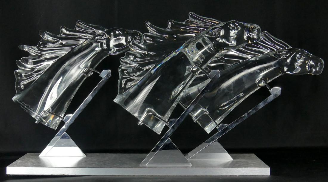 3pc DAUM 'GRAND PRIX' CRYSTAL HORSE HEADS w STAND: Daum French crystal 'Grand Prix' horse race. Depicts three horse heads mounted as if they are stretching their necks toward the finish line. Each piece sign Daum France near base. Numbered 129/200 to 