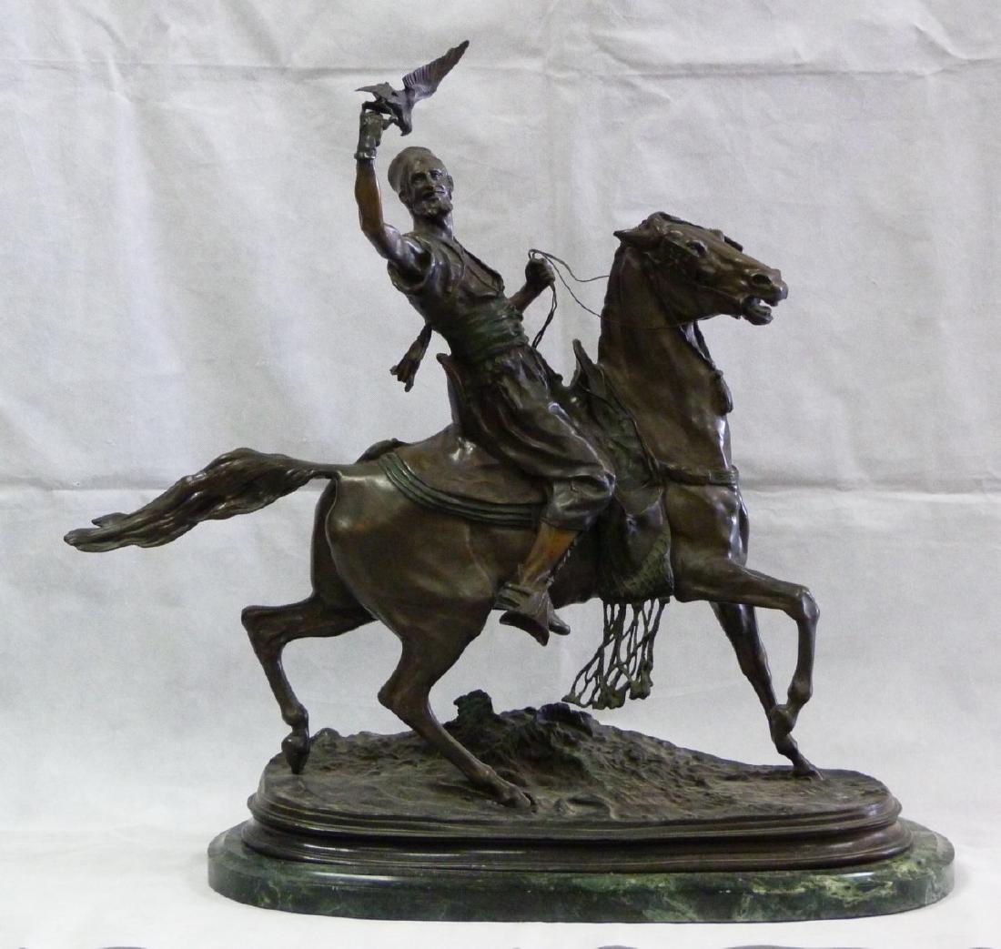 PJ MENE 'ARAB FALCONER ON HORSEBACK' BARBEDIENNE: Bronze sculpture depicting an Arab falconer on horseback after Pierre Jules Mene (French, 1810-1879). Titled 'Fauconnier Arabe a Cheval'. Signed to base and holds Barbedienne foundry mark. Measures 28