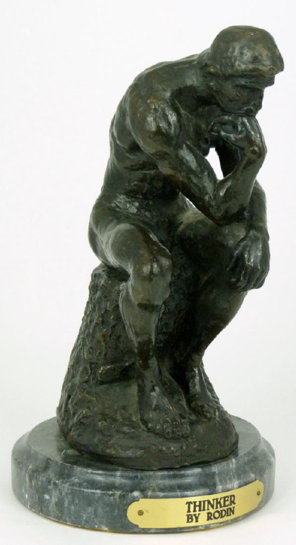 AUGUSTE RODIN 'THE THINKER' BRONZE SCULPTURE: Bronze sculpture of 'The Thinker' after Auguste Rodin. Signed and holds foundry mark to bronze base. Measures 9" (23cm) height + 1 1/4" (3cm) marble base.