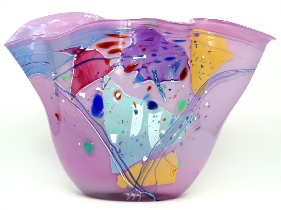 STEPHEN NELSON ABSTRACT ART GLASS VASE: Stephen Nelson studio art glass vase with applied abstract decoration. Signed along bottom edge and dated 1989. Measures 13 1/2" (34cm) width x 9" (23cm) height.