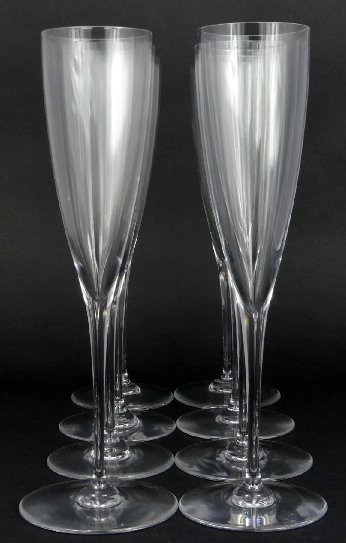 8pc BACCARAT 'DOM PERIGNON' CHAMPAGNE FLUTES: 8 Baccarat fluted champagne crystal glasses in the 'Dom Perignon' pattern. Each marked to underside and measures 9 1/4" (23.5cm) height.