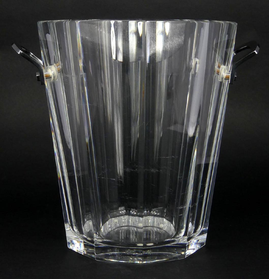 BACCARAT CRYSTAL 'MAXIM' CHAMPAGNE COOLER: Baccarat crystal ice bucket with silver plated handles. Marked to underside and impressed to each handle. Measures 9 1/8" (23cm) height x 7 5/8" (19.3cm) width.