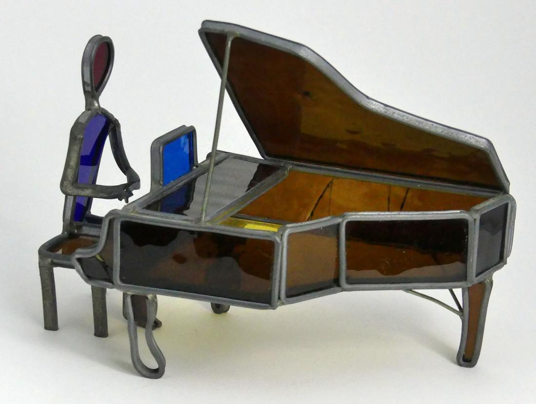 STAINED GLASS GRAND PIANO w SEATED PIANIST: Stained glass grand piano with pianist seated on bench. Piano measures 6 3/4" (17.2cm) length x 6 1/4" (15.8cm) height.