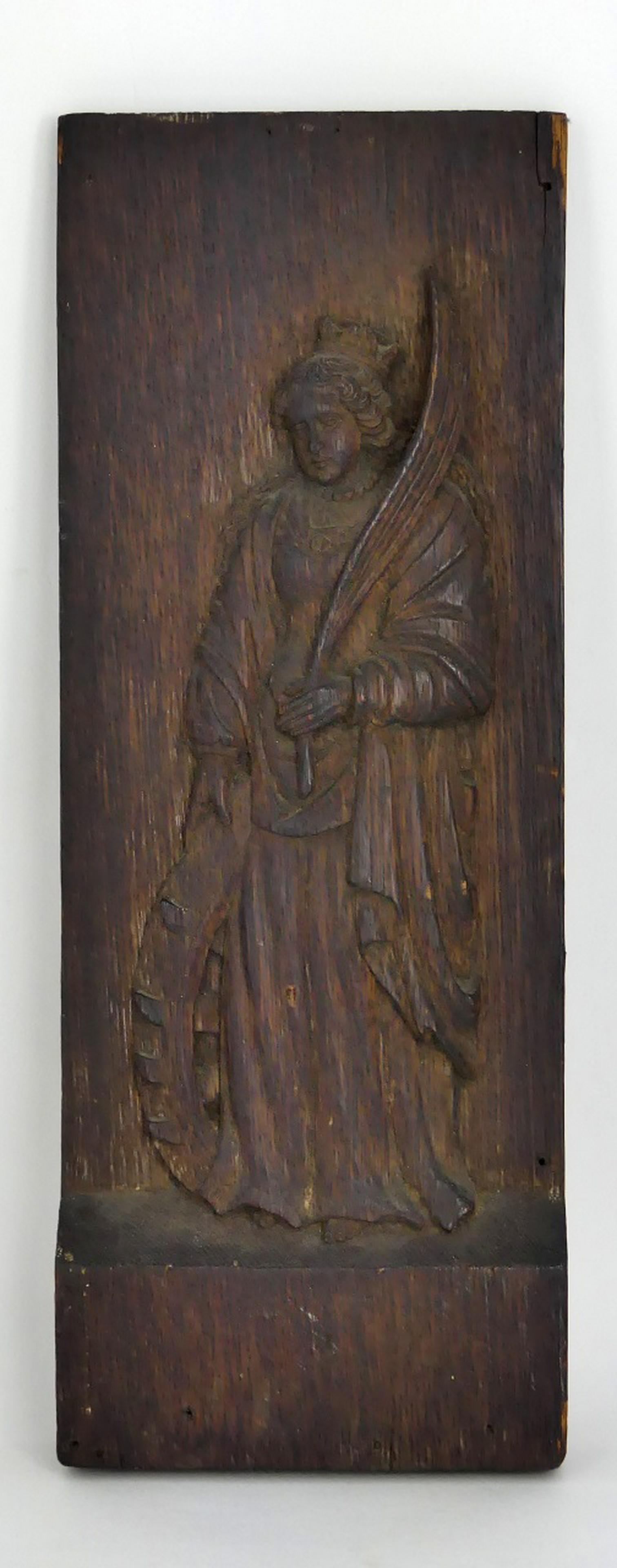 CARVED WOODEN PLAQUE OF QUEEN w FEATHER: Carved wood plaque depicting a crowned female figure with feather fan to her left hand. Measures 14 1/2" (36.8cm) x 5 1/2" (14cm). Remnants of old label to verso.
