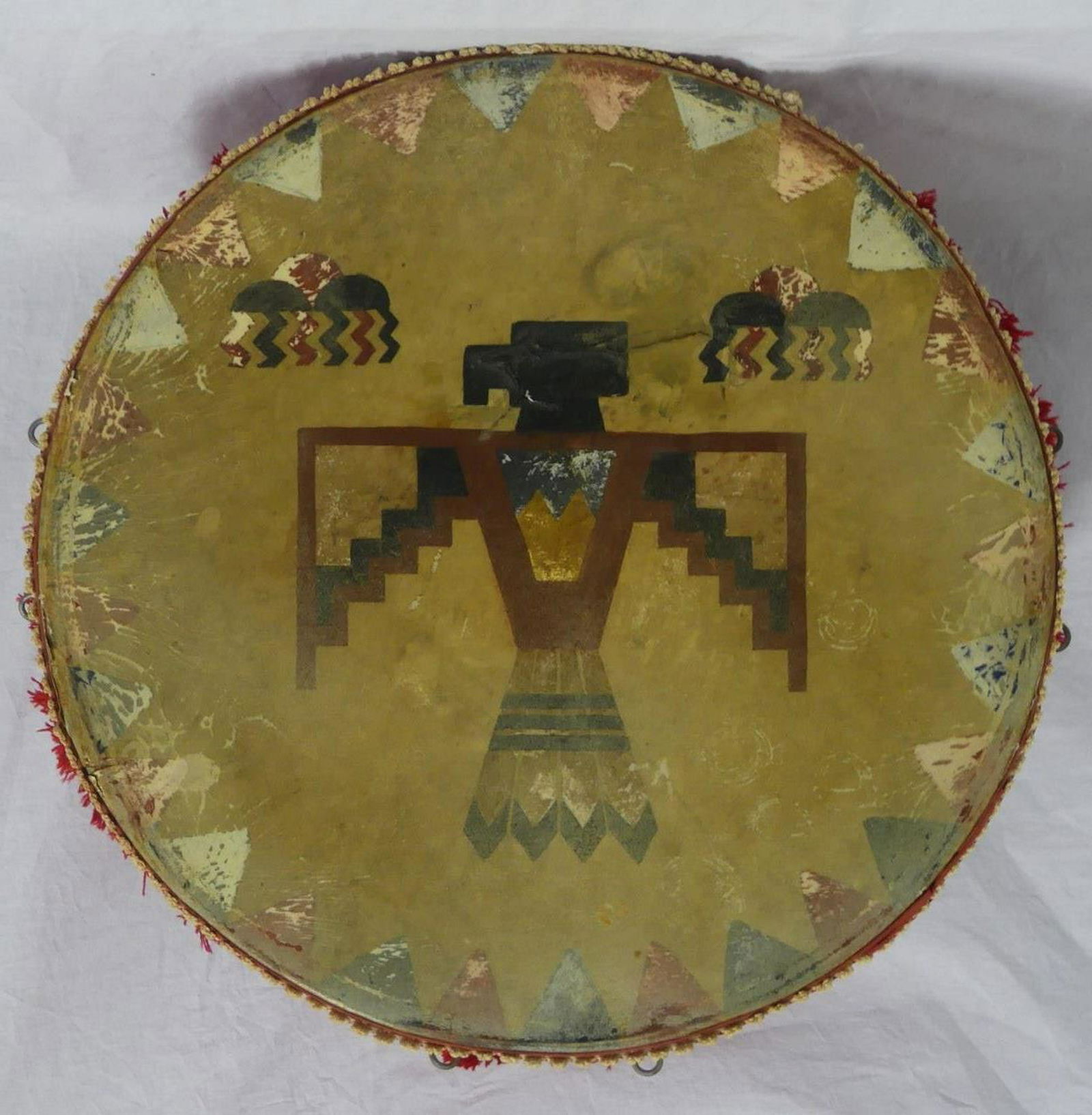 NATIVE AMERICAN INDIAN CEREMONIAL THUNDERBIRD DRUM: Native American Indian ceremonial drum with hand painted war eagle decoration. Measures 21 1/2" (54.5cm) diameter x 11 1/2" (29cm) height.