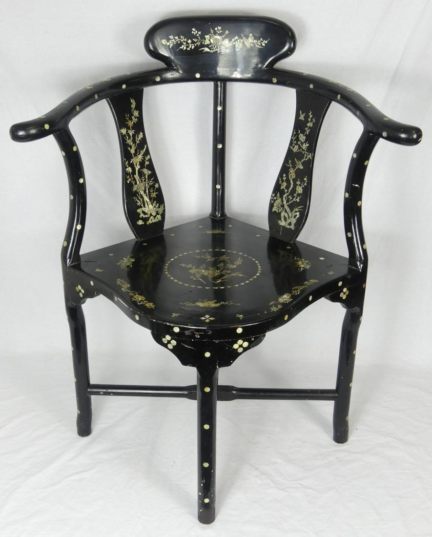 CHINESE MOTHER OF PEARL BLACK LACQUER CORNER CHAIR: Chinese black lacquered corner chair with mother of pearl inlay. Measures 34" (86cm) height x 27 1/4" (69cm) width.