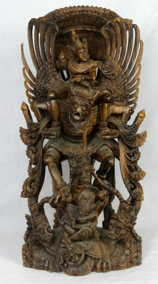 BALINESE WOOD CARVING OF VISHNU & GARUDA: Fine Balinese hardwood carving depicting Vishnu riding Garuda. Measures 24" (61cm) height.