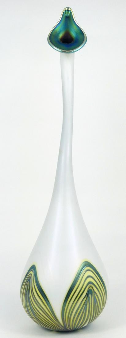 CHARLES LOTTON ART GLASS WATER SPRINKER VASE: Charles Lotton studio art glass Persian Water Sprinkler vase. White body with iridescent pulled feather accents around base and iridescent accent to inside rim. Signed to underside and dated 1981. Mea