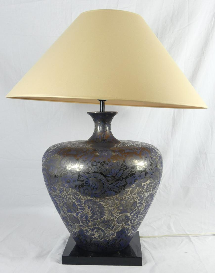 ROCHE BOBOIS PLATINUM & SILVER GLASS TABLE LAMP: Roche Bobois Italian glass lamp with floral blue and platinum decoration. Glass measures 16" height. Shade measures 23 1/4" diameter. Holds Eva Design label to underside. Purchased at Roche Bobois.