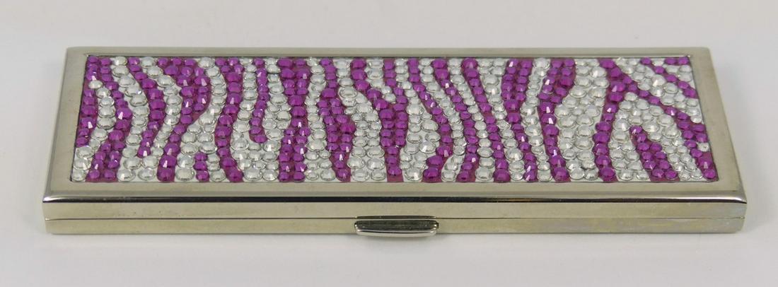 JUDITH LEIBER JEWELED COMPACT MIRROR: Judith Leiber compact mirror with jeweled pink and white animal stripe design. Signed to underside. Measures 4" length.