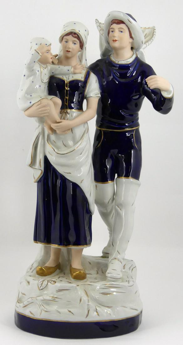 ROYAL DUX 'FISHERMAN & FAMILY' PORCELAIN GROUPING: Royal Dux porcelain group figure depicting a fisherman with his family. Hand painted blue and white with gilt decoration. Marked to underside. Measures 18 3/8" (46.7cm) height.