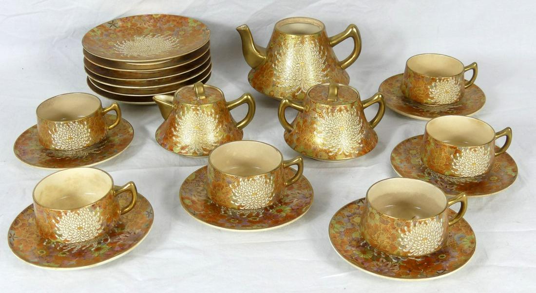 27pc JAPANESE SATSUMA PORCELAIN TEA SET: 27 pieces of Japanese Meiji Period Satsuma in the Chrysanthemum pattern. Includes 8-3 5/8" teacups, 8 saucers-5 3/8", 8 dessert plates-6 1/2", 1 teapot-6 3/8", 1 creamer-4 5/8" and 1 sugar-4 7/8". Eac