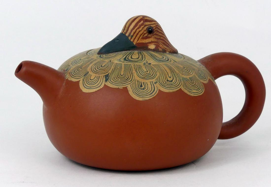 CHINESE YIXING CLAY DUCK TEAPOT w CERTIFICATE: Chinese Yixing Zisha clay teapot with duck head handle and painted feather design. Signed to underside. Includes certificate of authenticity. Measures 5 1/2" length.