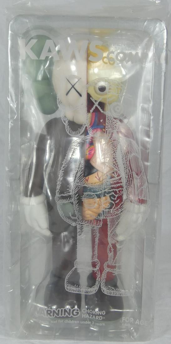 KAWS FLAYED DISSECTED COMPANION BROWN 2006: KAWS aka Brian Donnelly (American, b. 1974) Flayed Dissected Companion in brown. Painted cast vinyl. Marked Medicom Toy 2006 China and c. KAWS..06. Figure measures 14 1/2" height. Sealed in original p