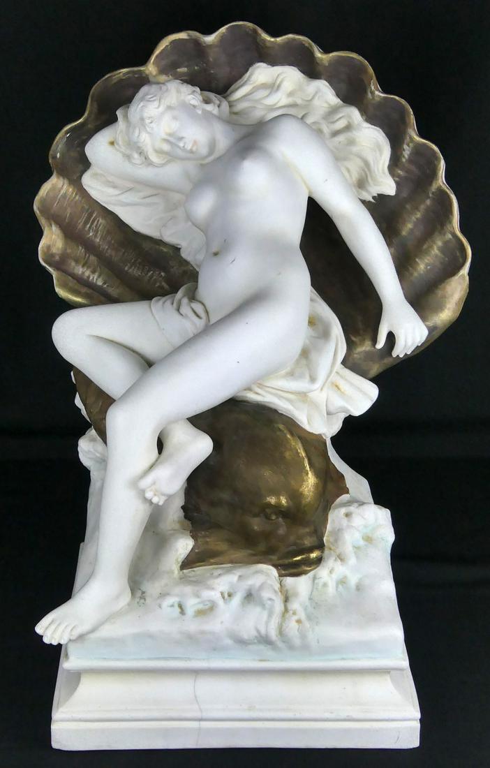 FRENCH BISQUE PORCELAIN NUDE ON DOLPHIN OLIVERI: Parian porcelain figure of Amphitrite on dolphin. Bisque with gilt accents. Signed Oliveri and impressed E B, PARIS. Measures 20" (50.8cm) height x 14" (35.5cm) width.