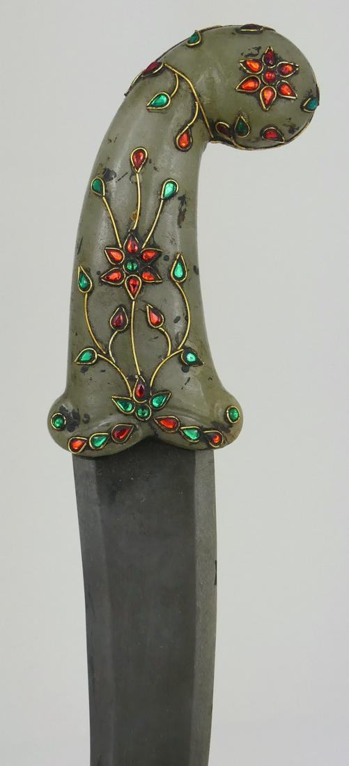 MUGHAL STYLE JADE JEWELED HANDLED DAGGER: Mughal style jade handled dagger decorated with jewels. Measures 11 1/4" length.