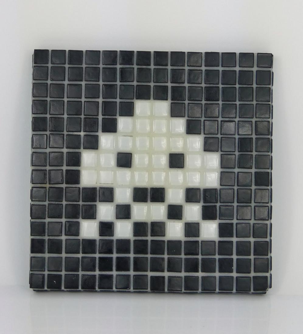 SPACE INVADER MOSAIC PLAQUE: Mosaic tile plaque depicting a character from an 8-bit video game. In the manner of Invader (French, b. 1969). Signed to verso over a teal blue ground. Measures 6 1/4" square.