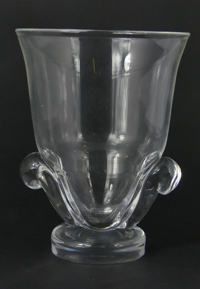 STEUBEN FOOTED & HANDLED CRYSTAL VASE: Steuben crystal vase with applied handles and pedestal base. Signed to underside. Measures 5 3/4" height. Chip to base.