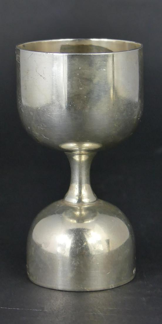 WATSON STERLING SILVER JIGGER: Vintage Watson sterling silver jigger for mixing drinks. One side marked 1oz, other marked 2oz. Stamped Sterling, W16 with hallmarks. Measures 3 3/8" height. Total weight 2.2ozt.