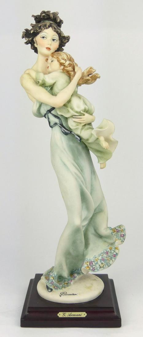 GIUSEPPE ARMANI MOTHER'S LOVE FIGURINE: Giuseppe Armani figure depicting mother holding daughter #754. Marked to base. Measures 14 1/4" height.