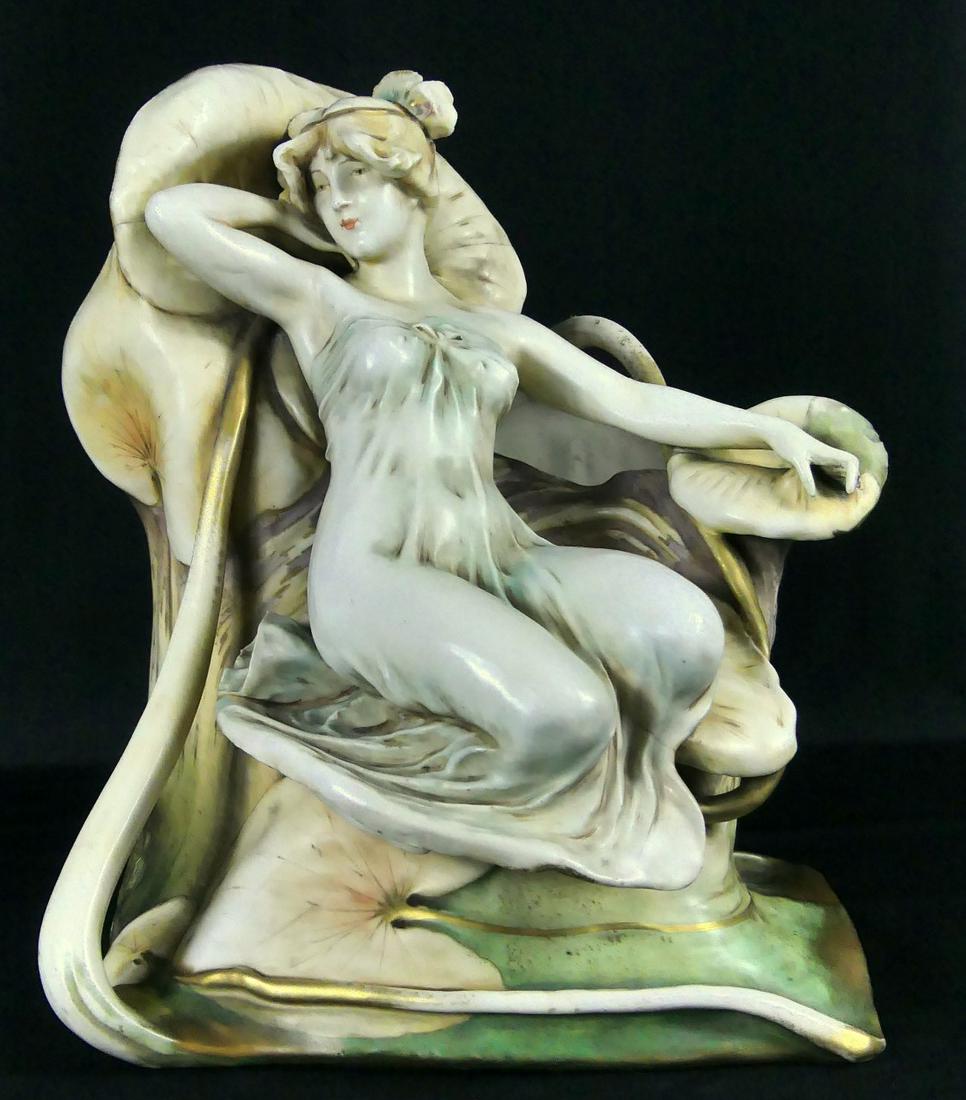 TURN TEPLITZ AUSTRIAN NOUVEAU FIGURAL VASE: Turn Teplitz Amphora Art Nouveau vase with seated figure. Marked to underside. Measures 13" height x 11" width.