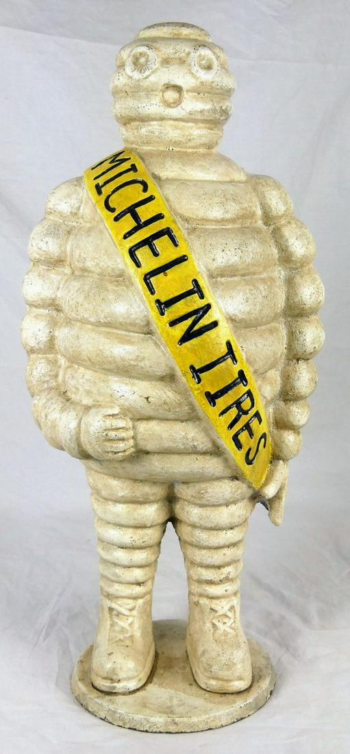 CAST IRON MICHELIN TIRE MAN BIBENDUM 22": Vintage cast iron Michelin Tyre Man advertising statue aka Bibendum or 'Bib'. Measures 22" height.
