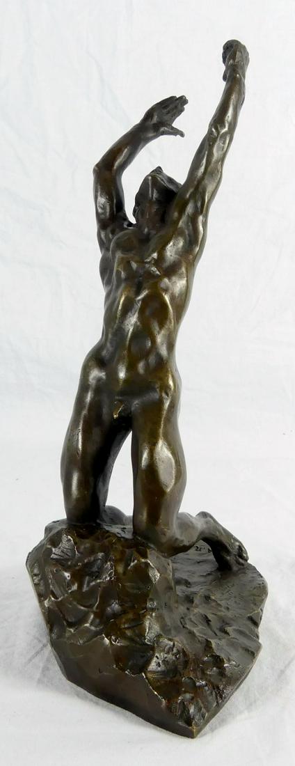 AUGUSTE RODIN 'PRODIGAL SON' BRONZE SCULPTURE: After Auguste Rodin (1840-1917) bronze sculpture depicting a nude male figure with arms raised, kneeling on a rock. Signed to bronze base. Measures 11 1/2" height. Includes certificate of authenticity
