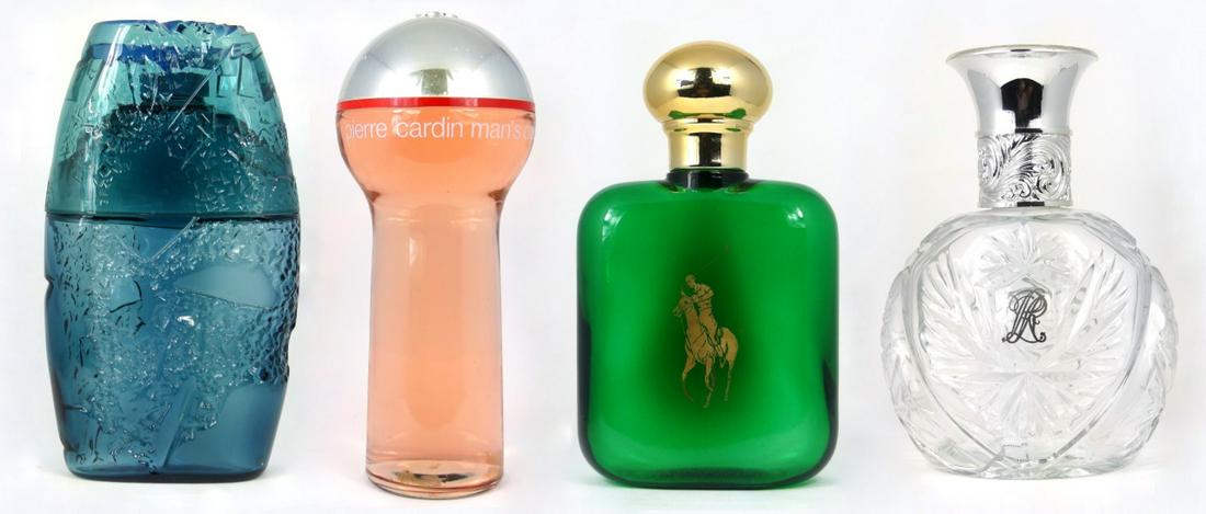 4pc FACTICE PERFUME BOTTLES: Four factice perfume / men's cologne bottles including Guy Laroche Horizon, Ralph Lauren Safari, Polo by Ralph Lauren and Pierre Cardin. Largest measures 13 1/2" height.