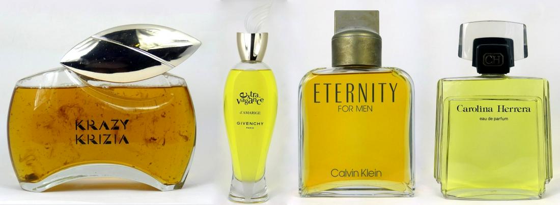 4pc FACTICE PERFUME BOTTLES: Four factice perfume and men's cologne bottles including Calvin Klein Eternity for Men, Carolina Herrera eau de parfum, Krazy Krizia and Givenchy Extravagance d'Amarige. Largest measures 19 1/4" heigh