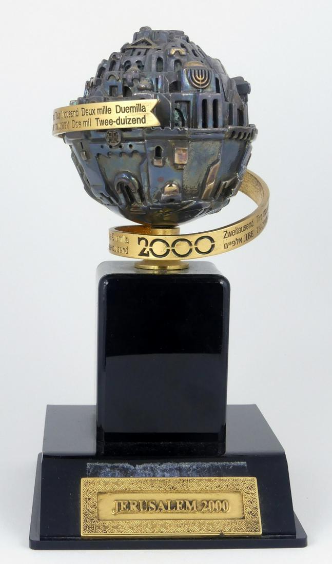 FRANK MEISLER 'JERUSALEM 2000' SCULPTURE: Frank Meisler vintage Israeli Jerusalem Globe. Silver plated and gold plated in the form of a rotating sphere. Signed Frank Meisler, Israel to verso and titled 'Jerusalem 2000' to front of base. Measu