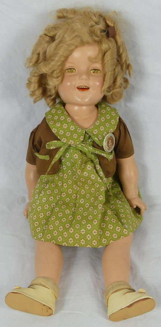 IDEAL SHIRLEY TEMPLE DOLL: Ideal Shirley Temple doll. Marked to back of head. Measures 23 1/2" length.