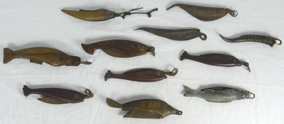 11pc CHINESE FISH KNIVES LARGE: Collection of 11 antique Chinese folding fish knives. Includes 7 carved wood, 1 horn or antler and 3 metal. Largest measures 8 1/2" length in the closed position. keyword: knife