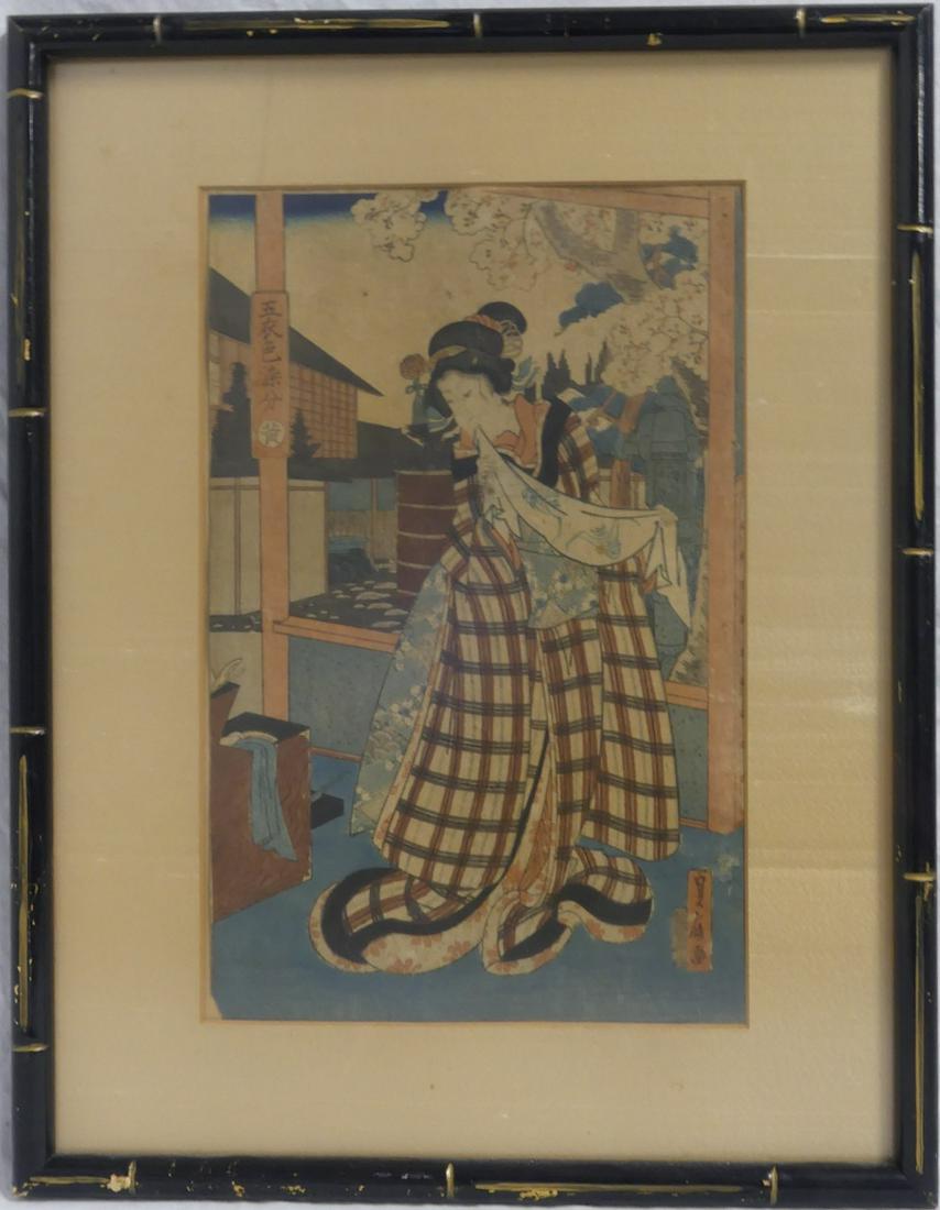 JAPANESE WOODBLOCK PRINT OF GEISHA SIGNED: Japanese woodblock print depicting a Geisha. Holds calligraphy upper left and lower right. Measures 14 1/2" x 9 1/4" + 3" mat & frame.