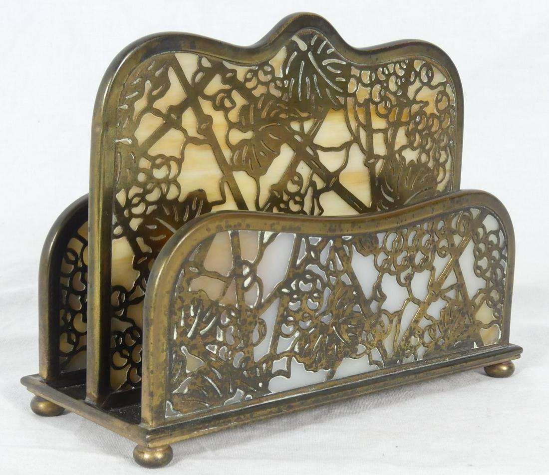 TIFFANY STUDIOS 'GRAPEVINE' BRONZE LETTER HOLDER: Tiffany Studios bronze and slag glass letter rack in the 'Grapevine' pattern. Marked Tiffany Studios, New York and numbered 1019 to underside. Measures 6 1/4" length x 4 3/4" height.