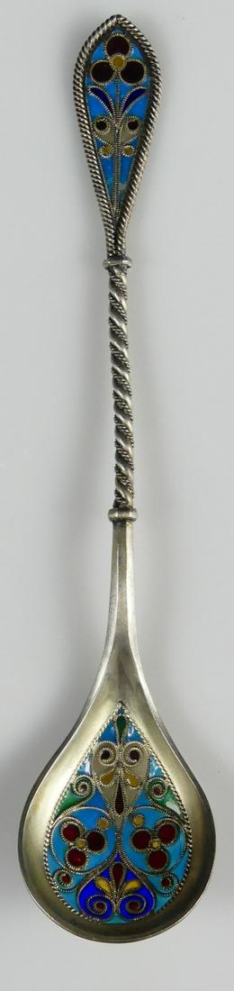 PLIQUE-A-JOUR STERLING SILVER SPOON: Plique a Jour and sterling silver soon. Likely Norwegian. Hallmarked IH&Co and marked Sterling, 900. Measures 6 1/4" length.