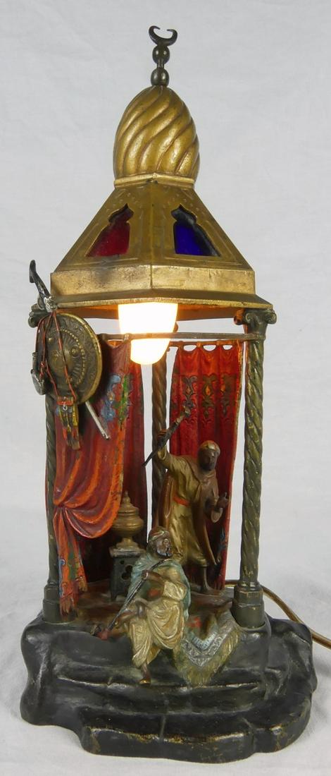 FRANZ BERGMAN VIENNA BRONZE TENT LAMP: Franz Bergmann (Austrian, 1861-1936) cold-painted polychrome bronze lamp depicting two Arabs in a tent. Holds Bergman B urn and marked Austria. Measures 10" height.