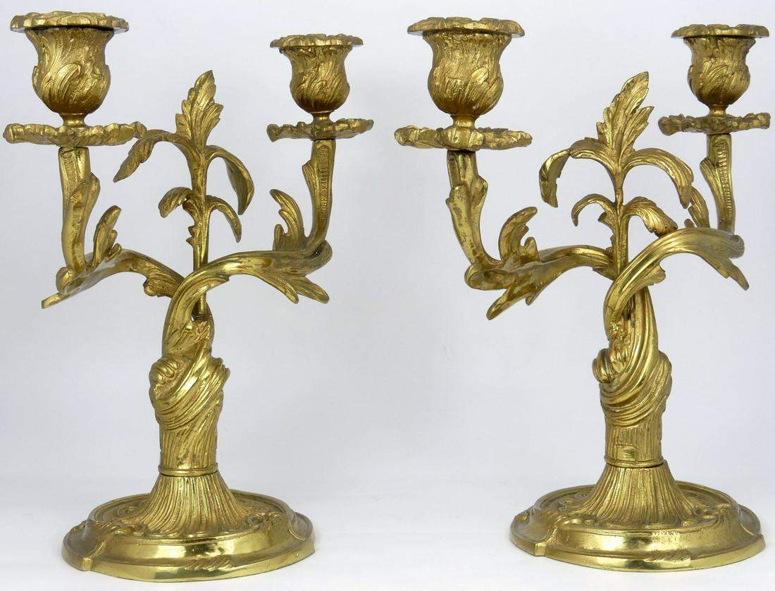 PR GILT ROCOCO STYLE 2-LIGHT CANDELABRA: Pair of gilt metal Rococo style two-light candelabra. Each measures 11 1/4" height and width.